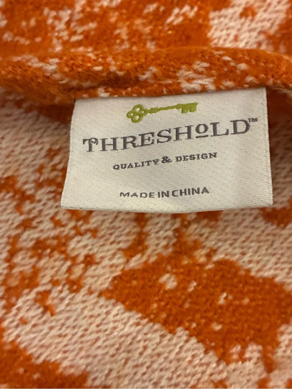 Threshold soft woven throw with knotted tassels. 60”x50”.